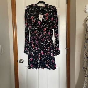 Free People black floral button front dress.